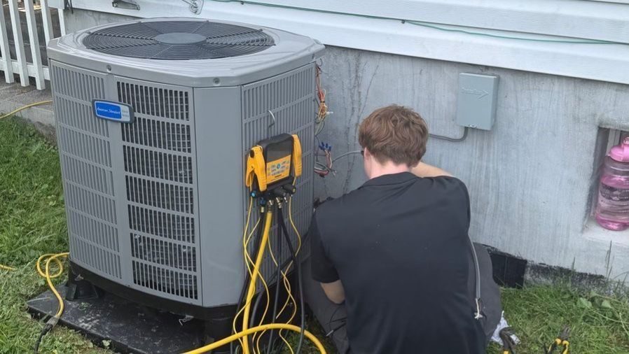 HVAC tech conducting HVAC tuneup.